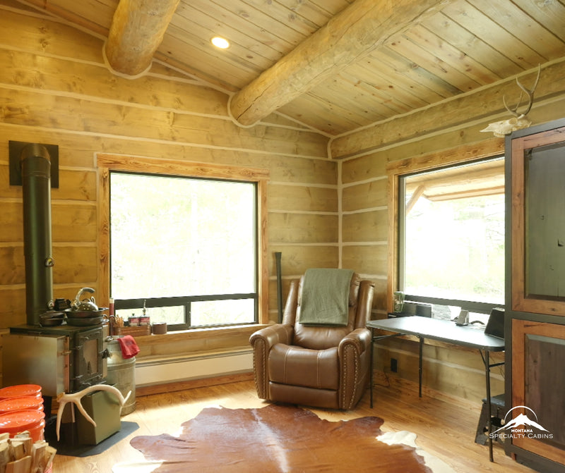 A bright, open living space framed by hand-scribed log walls.