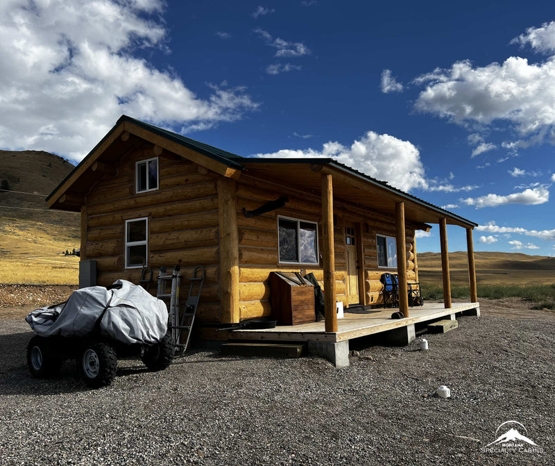 Front corner view with natural log finish and porch
