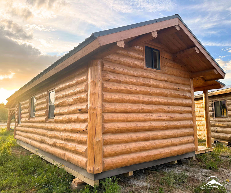 Rear exterior showing loft window and log construction