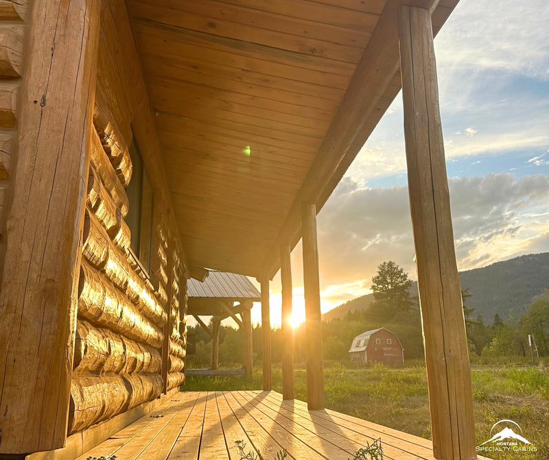 Covered porch view of the Bison View 12×30 at sunset