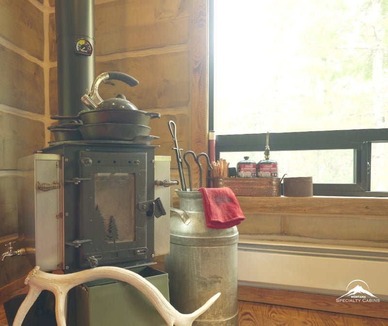 A wood stove corner that brings warmth and old-school cabin charm.