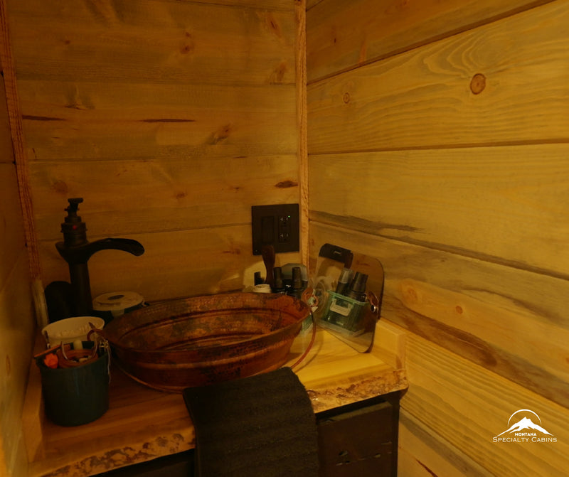A copper vessel sink set on a live-edge vanity for a true rustic touch.